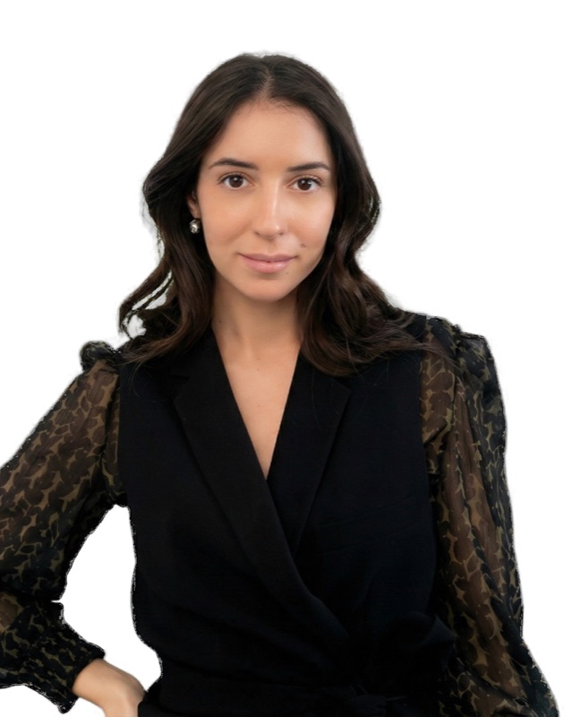 Madalena, founder of PeakFlow, in a black blazer against a white background